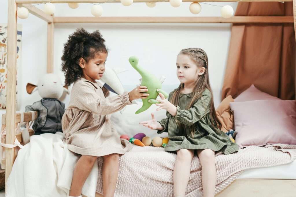 A Teaching Toddlers to Share toys with a friend during playtime. 